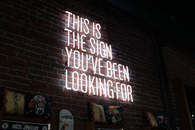 new years resolutions ideas a neon ligh sign saying this is the sign you've been looking for