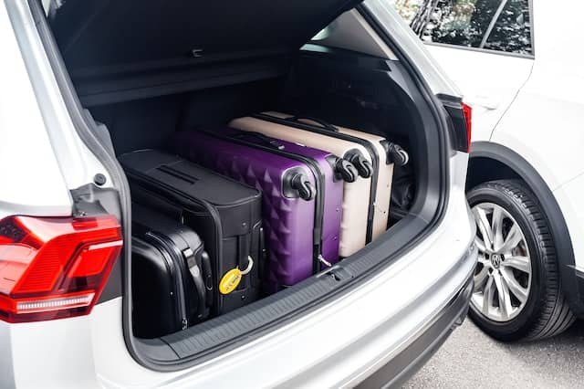 luggages packed in a car booth