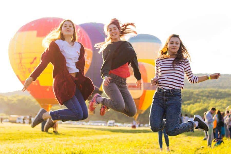 three females jumping freely in the air