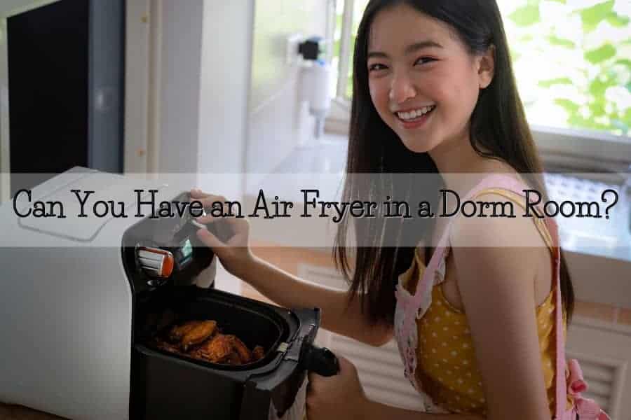 girl using ait fryer in dorm