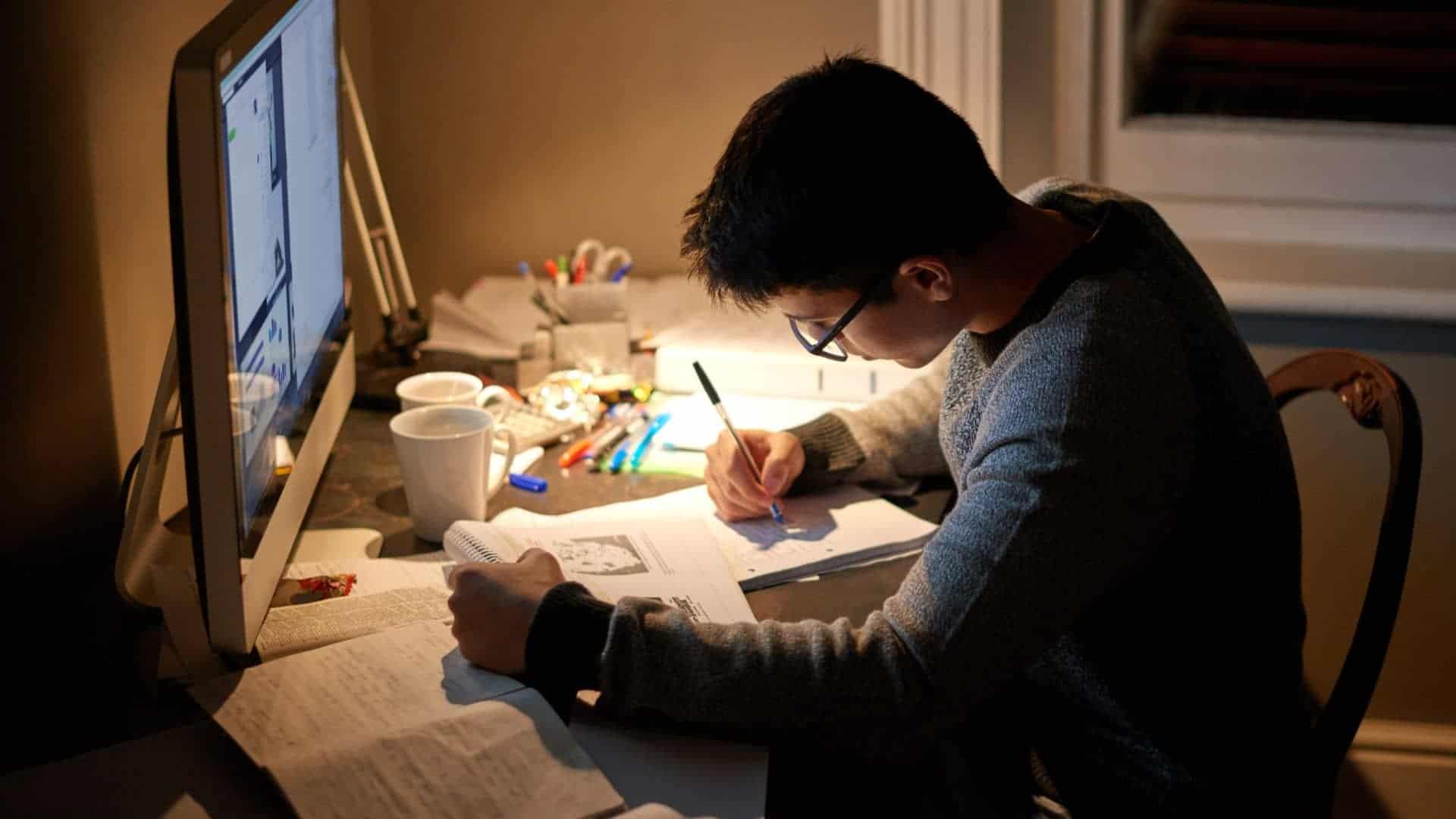 guy students studying alone at desk is a common study mistake to avoid