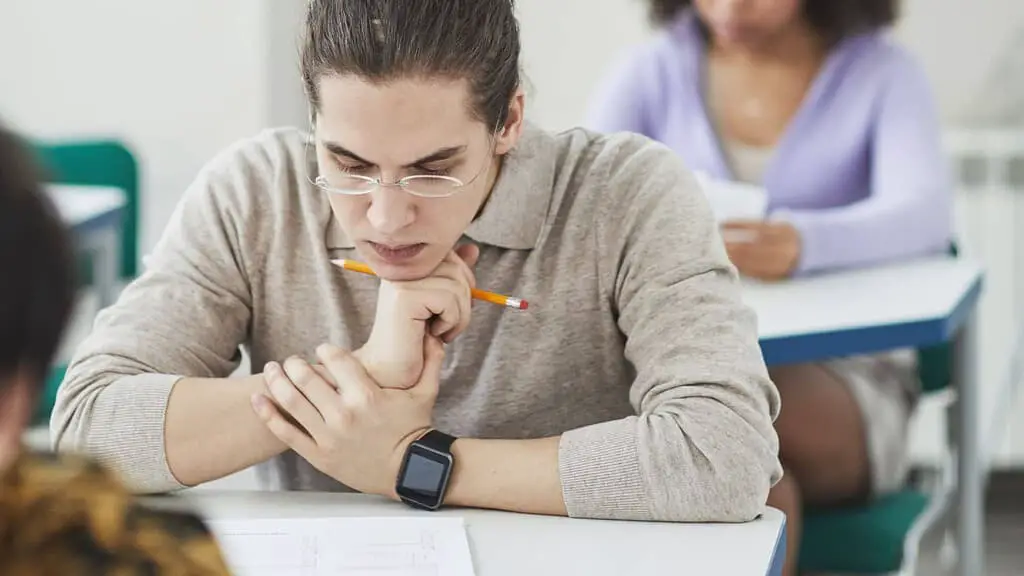 man sitting in exam after studying the correct exam format