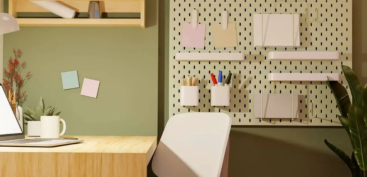 dorm room with pegboard on dorm wall, desk and chair