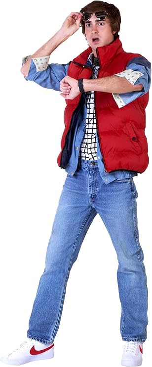Man dressed as Marty McFly from *Back to the Future*, wearing a red puffer vest over a denim jacket, checkered shirt, blue jeans, and white sneakers with red swooshes. This 1980s-inspired look is a nostalgic and fun choice for Halloween costumes for guys who love movie-themed outfits.