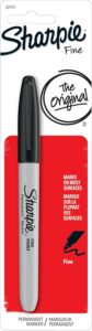 A packaged black Sharpie Fine Point permanent marker labeled “The Original,” designed to write on most surfaces. Handy for customizing DIY *Halloween costumes for guys* with drawn-on details, fake tattoos, or handwritten labels.