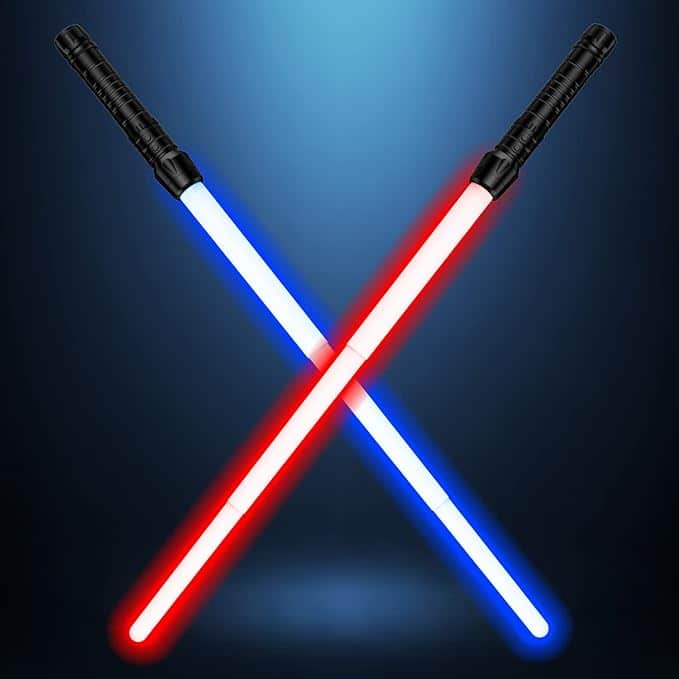 Two glowing toy lightsabers, one red and one blue, crossed against a dark background with black textured handles. These make perfect accessories for sci-fi-themed Halloween costumes for guys, adding a dramatic touch to Jedi or Sith outfits.