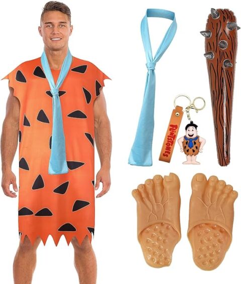Man dressed as Fred Flintstone in an orange tunic with black triangles, a blue necktie, oversized caveman feet, and accessories including a spiked club and keychains. This prehistoric getup is a playful and nostalgic option for Halloween costumes for guys who want to rock a cartoon classic.