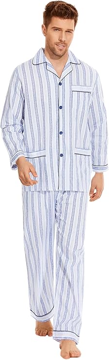 A man wearing classic light blue and white striped pajamas with a button-up top and matching pants, featuring dark blue piping on the collar, cuffs, and pockets. These PJs can be used for simple and cozy Halloween costumes for guys, like a sleepwalker or a character from a bedtime-themed look.