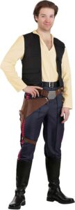 A man dressed in a space smuggler costume featuring a yellow V-neck shirt, black utility vest, navy pants with red side stripes, a brown holster belt, and black knee-high boots. A great choice for sci-fi-inspired Halloween costumes for guys channeling a roguish hero look.