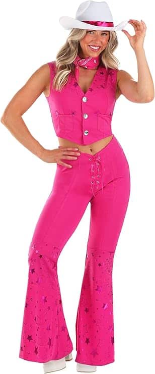 Image of a woman dressed in a hot pink cowgirl outfit featuring flared pants, a matching vest, a pink neck scarf, and a white cowboy hat with a pink band. This stylish and confident look is perfect for **Barbie Halloween Costumes for Adults**, capturing the fun and fashionable spirit of cowgirl Barbie for Halloween parties or themed events.