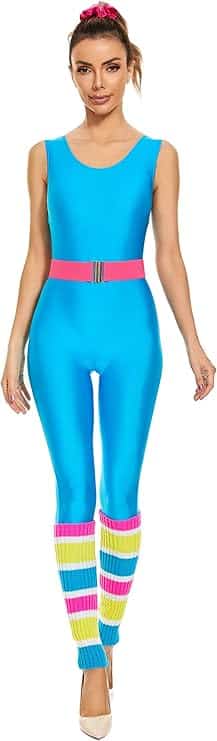 Image of a woman wearing a bright blue sleeveless jumpsuit with a pink belt, colorful striped leg warmers, and a matching pink hair scrunchie. This retro-inspired outfit perfectly fits **Barbie Halloween Costumes for Adults**, capturing the fun and energetic 80s workout Barbie look for Halloween parties or themed dress-up events.